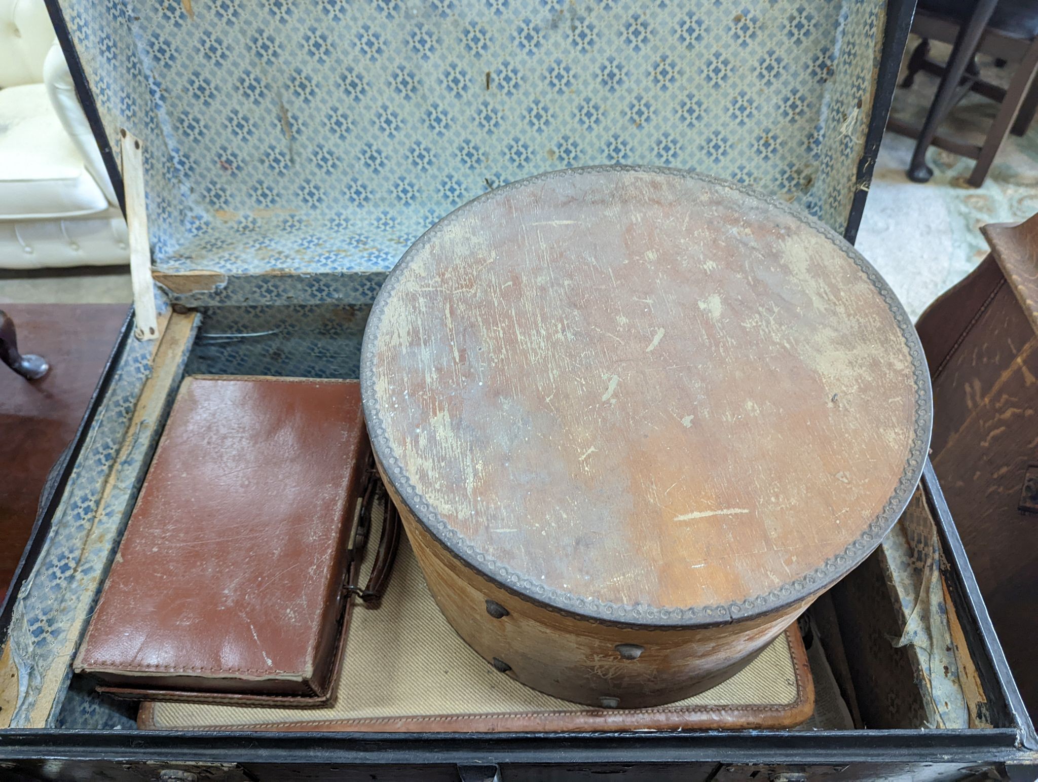 A vintage iron bound wooden travelling trunk, a suitcase, hat box, an artist travel case, and green baize compartments and a small attache case (6)